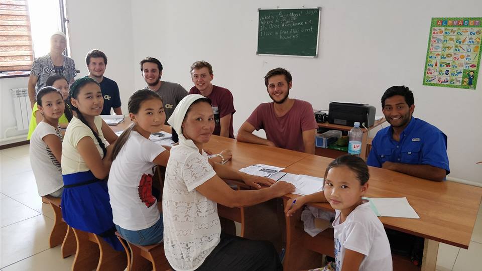 GeorgiaTech's tweet photo. GT students on 10,000-mile charity rally stopped in Kazakhstan to give class their first conversation in English. | https://t.co/3XkOyMqqMV https://t.co/oJLQ05EqOt