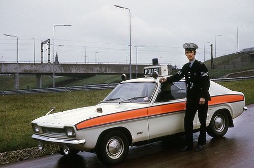A sergeant stands beside a classic Ford Capri #police car in February '75. This was one of the stalwarts of traffic policing for many years.