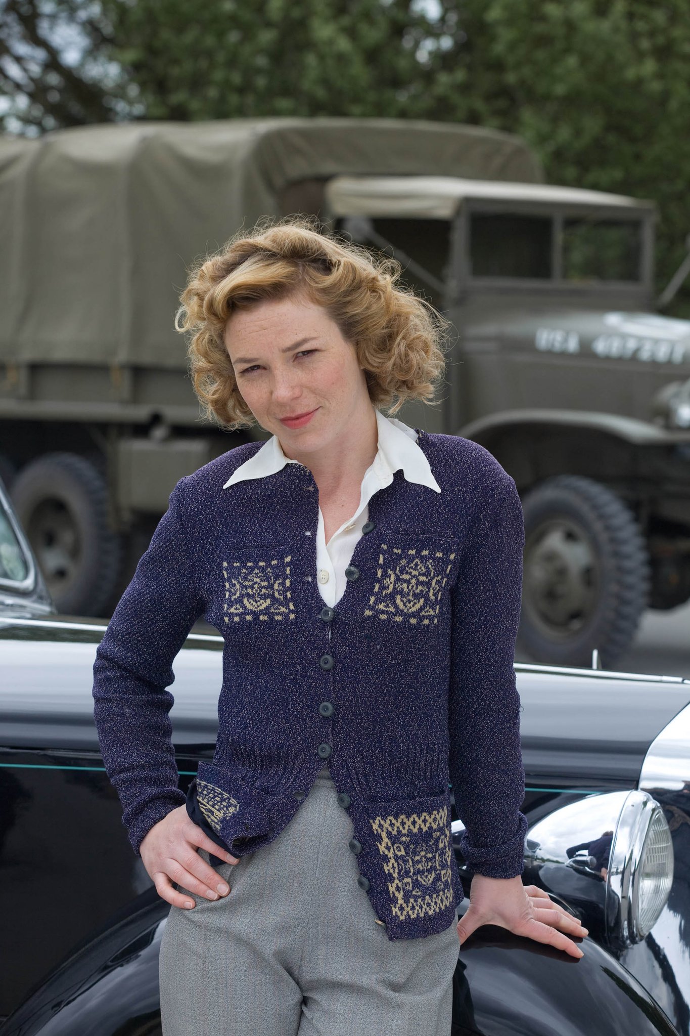 A very Happy Birthday to Honeysuckle Weeks. Here she is as Sam Stewart, leaning on a car. 