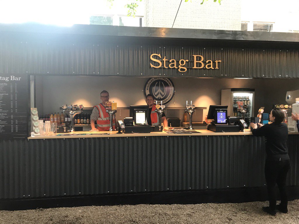 Mark and Rich behind yet another bar built by us &amp; yet unable to touch the beer!