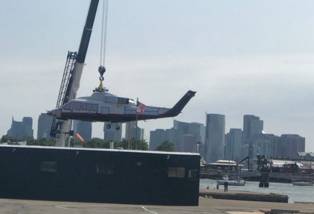 Before this Trump helicopter was removed for repairs, the Trump logo and identifying marks were covered.