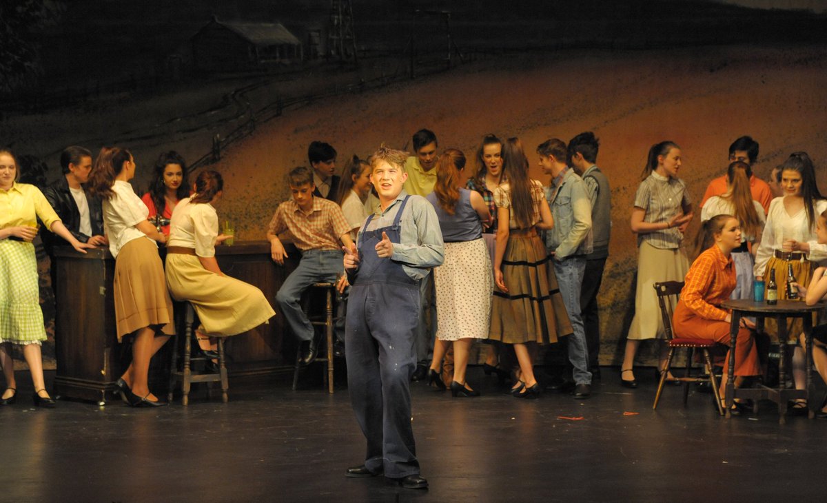 George Fall-Taylor as Edward and the townspeople in a scene from #WODYS Whistle Down The Wind.