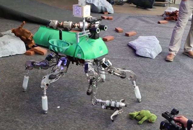 Six-legged LAURON Robot grabs plush frog in demonstration. Robot is designed for planetary exploration bit.ly/2vfMjVp
