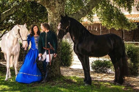 VictorianChoice's tweet photo. Is this a scene from Game of Thrones?! 😍 Lisa and Phillip look magnificent next to their Friesian stallions! Shop @ https://t.co/OKaB35ADiu https://t.co/YvKvwApPRJ