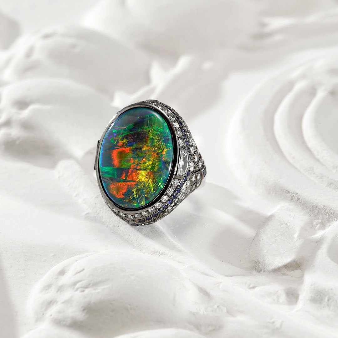 Crafted using an Australian Opal, our Lightning Ridge Black Opal Blue Sapphire &amp; Diamond Ring emanates opulence. bit.ly/2tXN1CN