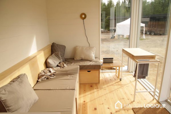 I love the living area in this tiny house on wheels! Those windows are the best! See more: tinyhousetalk.com/the-novio-tiny…
