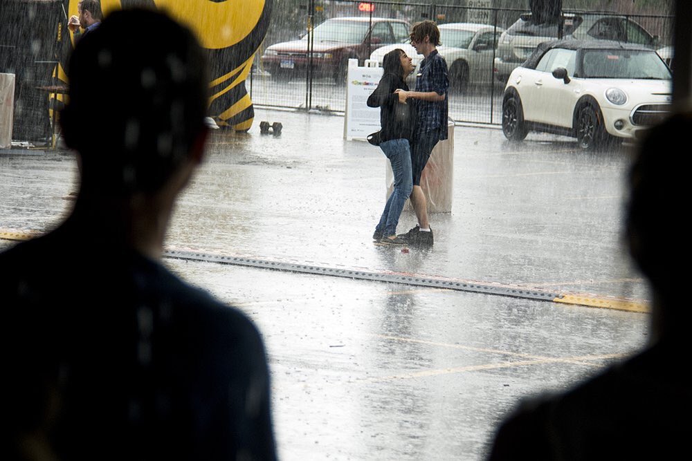 TheUMS's tweet photo. Thanks to @KevinJBeaty for capturing this shot, and shoutout to these folks making the best of the rain this weekend. โค๏ธโ๏ธ #UMS2017 https://t.co/diwogHrqH4