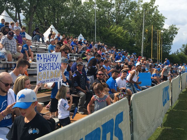 Fans have signs to wish Lions WR Golden Tate a happy birthday...and to request they sign...  