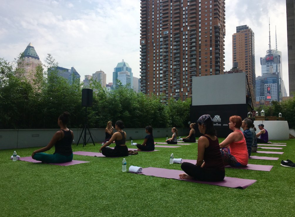 The <a href="/YotelHQ/">YOTEL</a> team battles today's heat with a terrace yoga session in
partnership with <a href="/mindfreshco/">MINDFRESH</a> 🙏🏻 #namaste #client