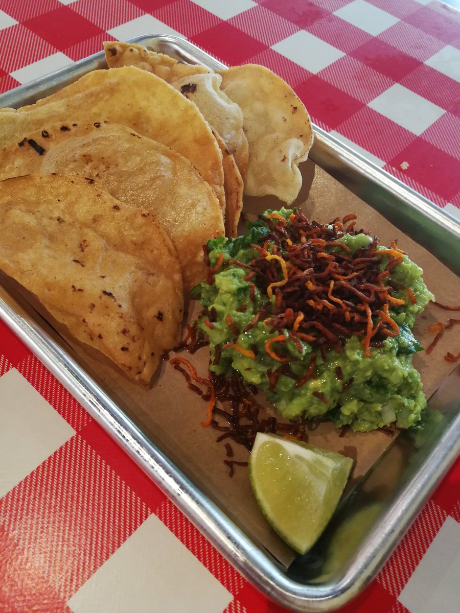 guac topped with crispy carrots.