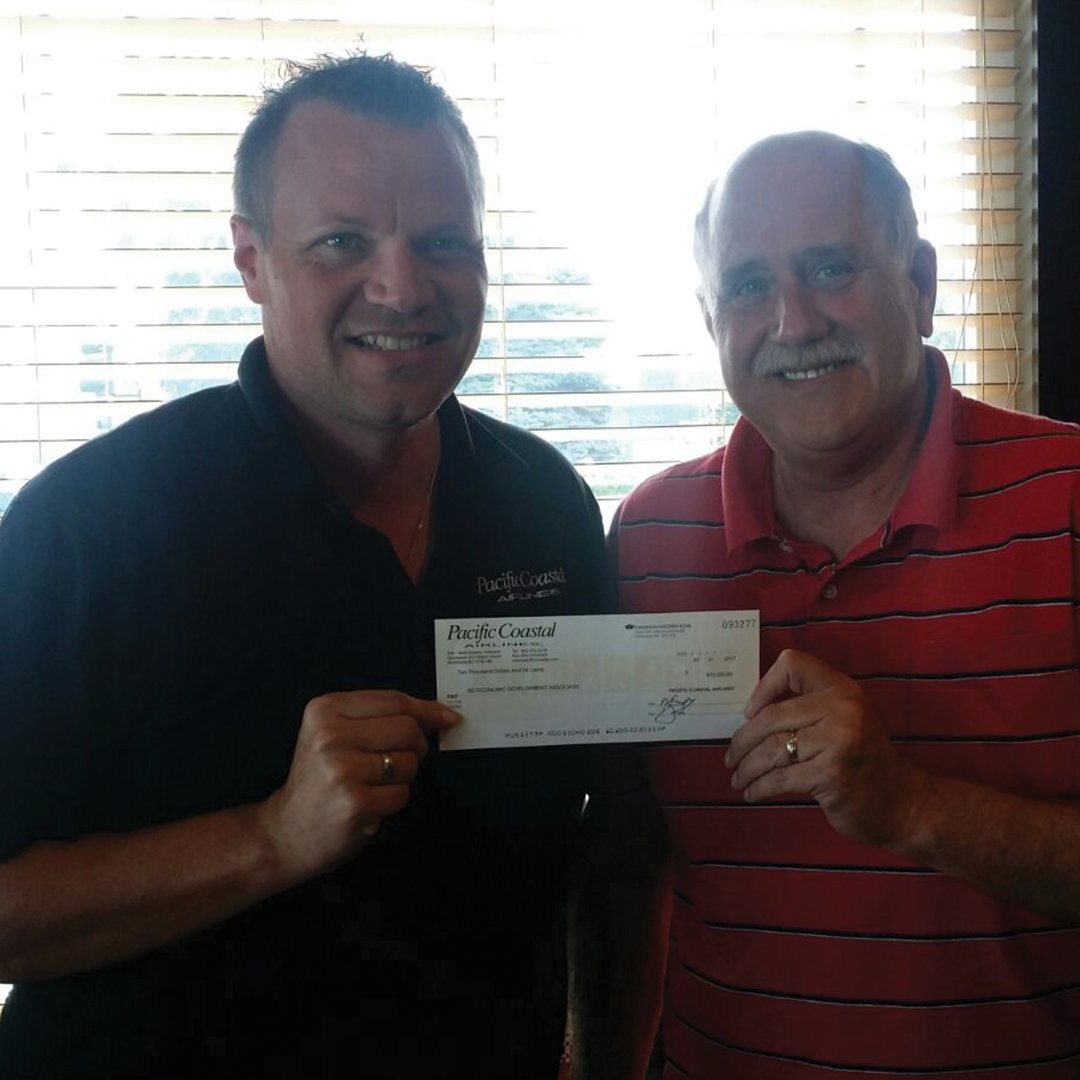 PacificCoastal's tweet photo. Shawn Warneboldt of PCA handing a CQ for $10,000 to Dale Wheeldon of @EconomicDevBC for its Economic Disaster Recovery Program https://t.co/ecklgK1iIW