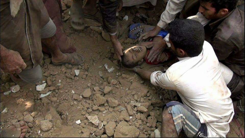 SamWalton's tweet photo. The bodies of children &amp; adults are pulled from the rubble in Yemen. Until we  #StopArmingSaudi we are complicit in these war crimes. https://t.co/2KKeHuuiDb