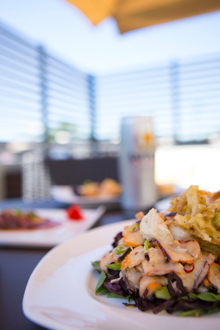 Try our Crab and Marinated Squid, drizzled with Peanut Miso Vinaigrette, and dressed next to a Vegetable Kakiage.