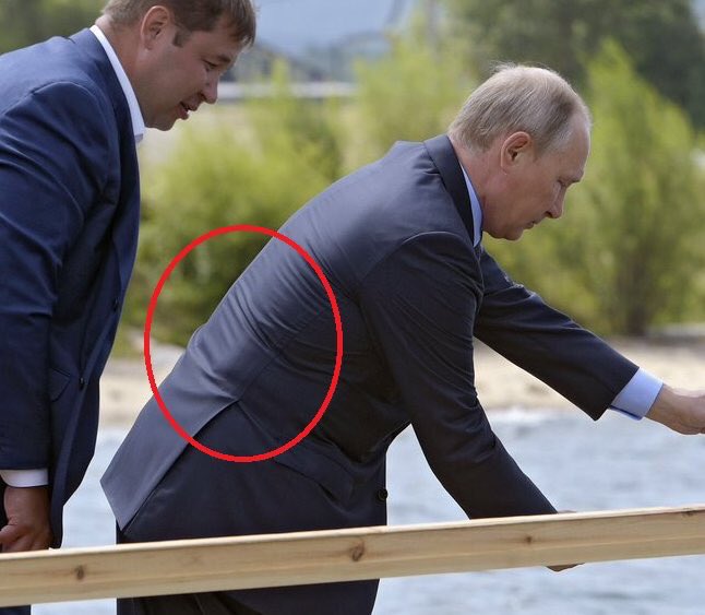 Fact Check-Image of Putin hunched over in suit jacket dates to August 2017  and is not proof that he recently started wearing a bulletproof vest |  Reuters