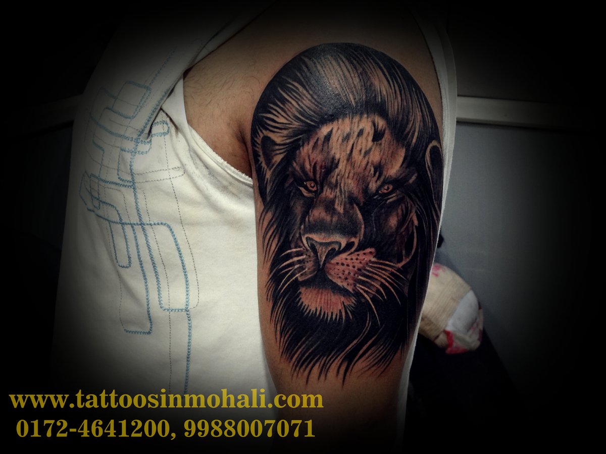 Tribal Lion Tattoo On Shoulder And Chest