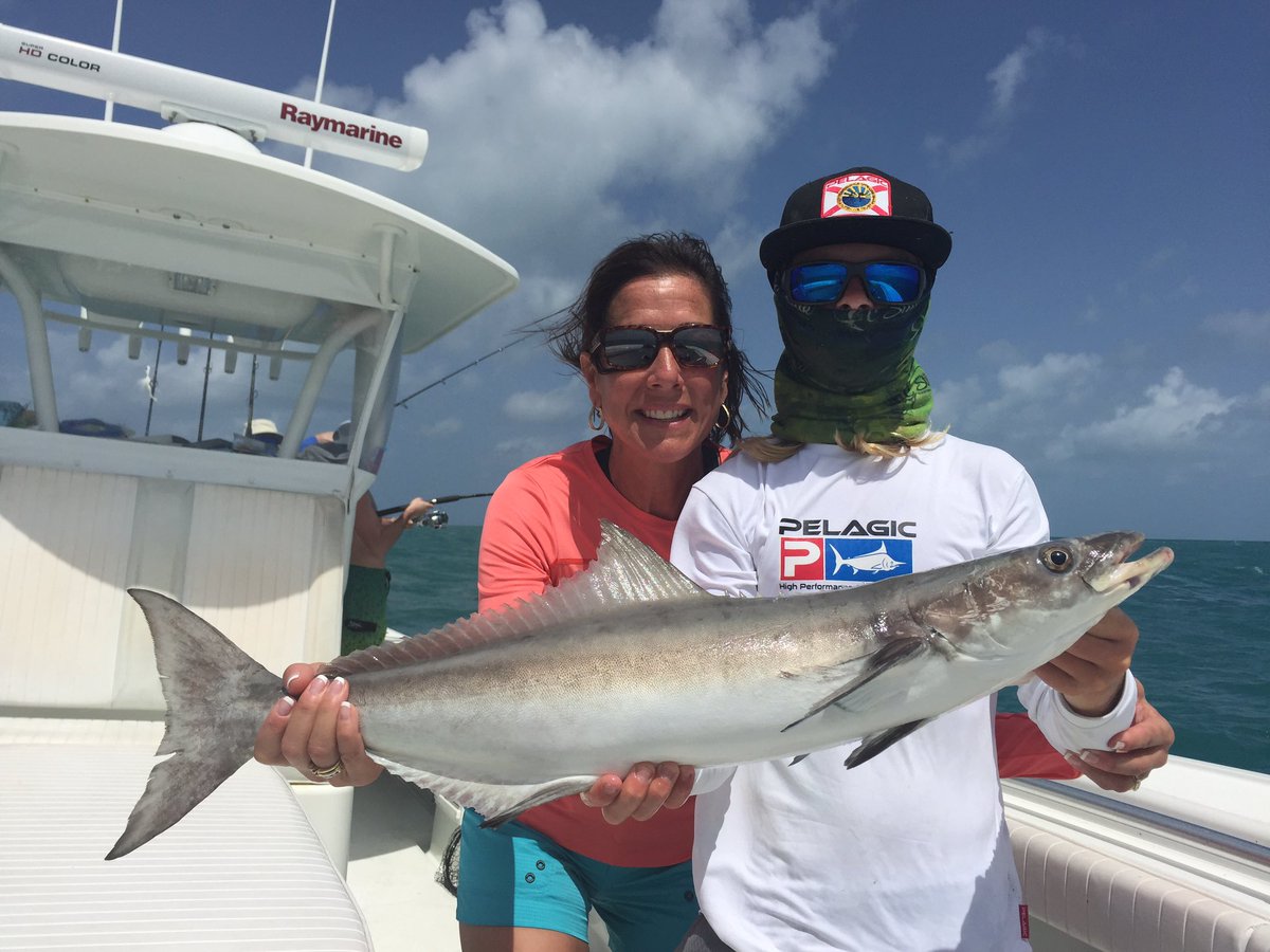Twoconchs's tweet photo. First Mate JC helping Momma Griff with her Cobia before they released it. @PelagicGear #FirstMateJC #PelagicGear @Raymarine #TwoConchs https://t.co/EY6DaD0xDW