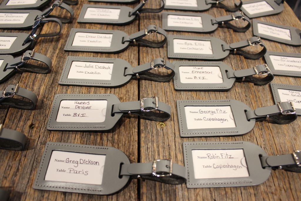 What a cool way to incorporate your love of travel into escort cards! Each luggage tag will take your guest to a destination themed table!