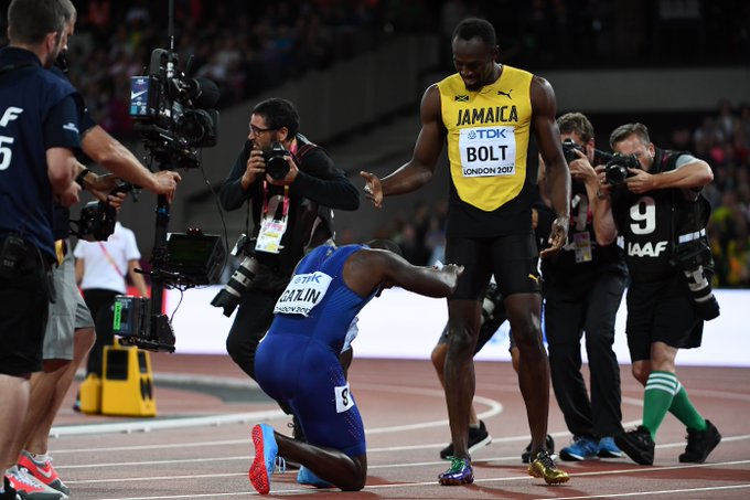 Image result for Justin Gatlin defeats Usain Bolt in the final solo race of his career and bows to him