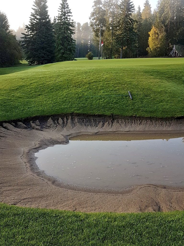 Washouts in greenside bunkers without puddles will be pushed up. Puddles will be pumped and raked as we remove water. 56mm of rain.