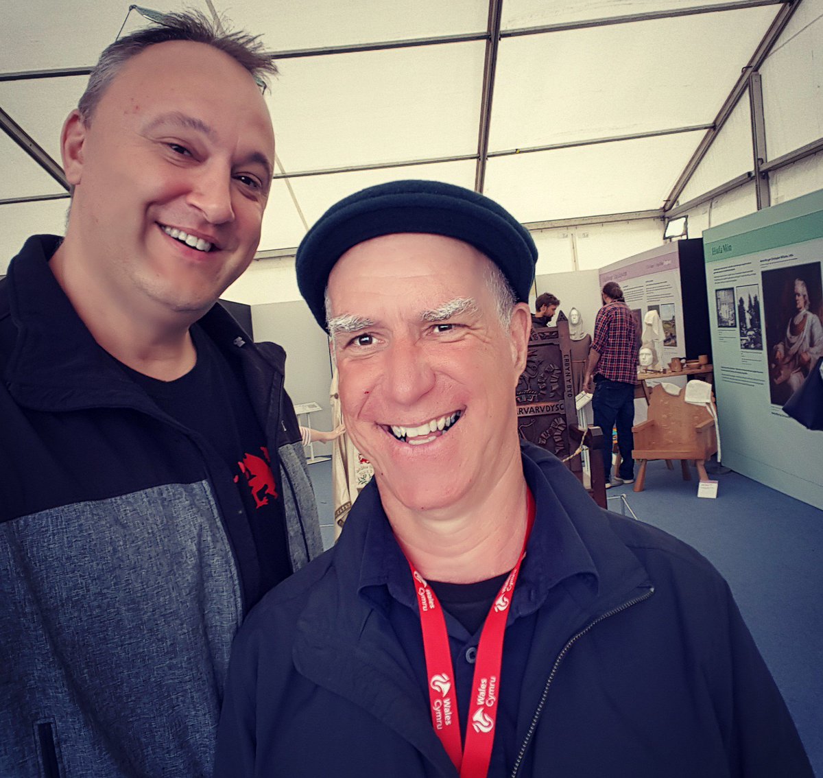Kristoffer with the coolest archaeologist known to mankind @therealrhysmwyn the History pavilion #Anglesey @eisteddfod just before the rain