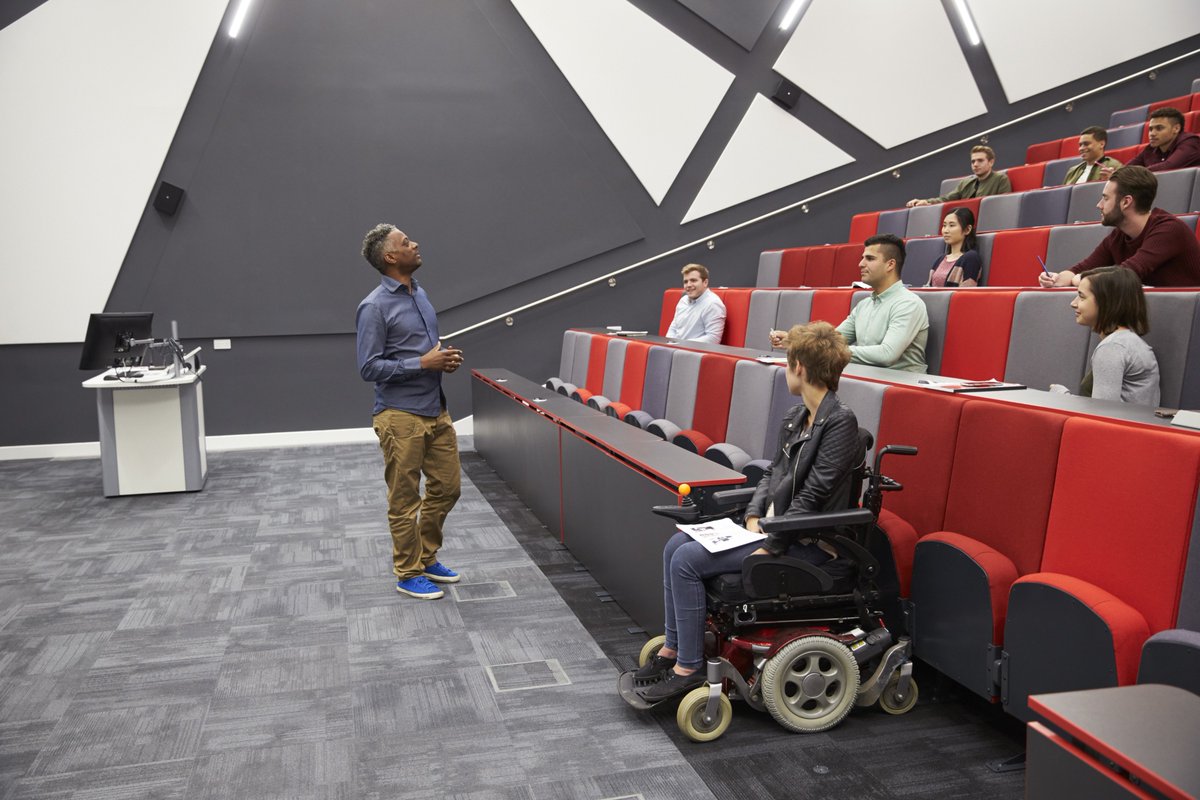 student in wheelchair in university lecture hall