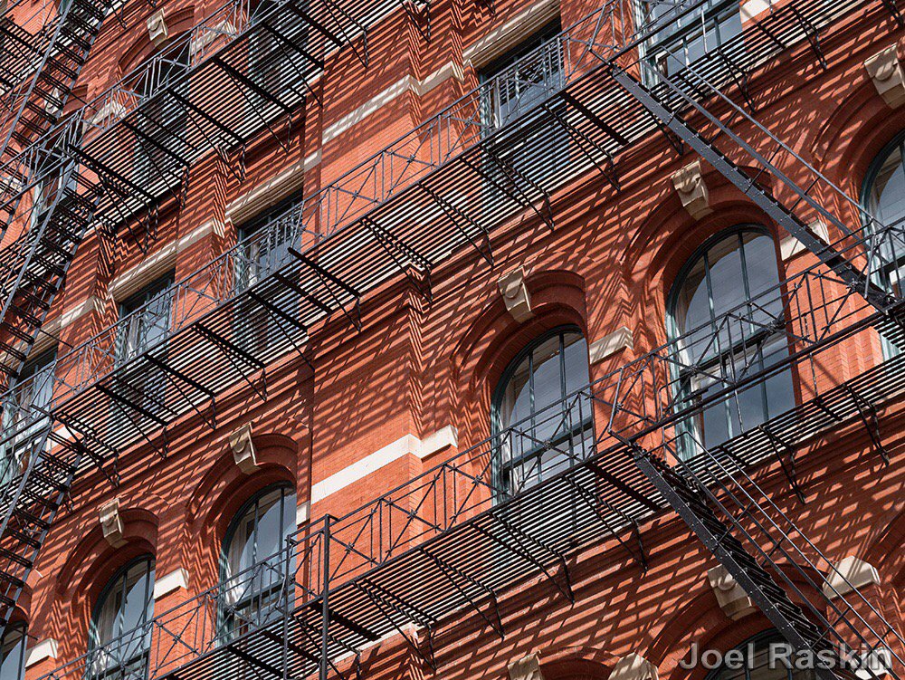 JoelRaskin's tweet photo. Shadowy #FireEscapes on a  #building in #soho #NYC https://t.co/fjPJ7vockv