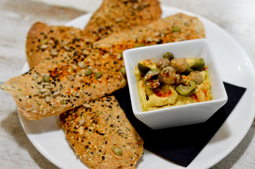 LibraryKitchen's tweet image. This House-made Hummus and 5-seed Lavash with Olives is from Chef Johannes &amp;amp; Michelle Dim-St Pierre's upcoming cookbook and is on our menu!