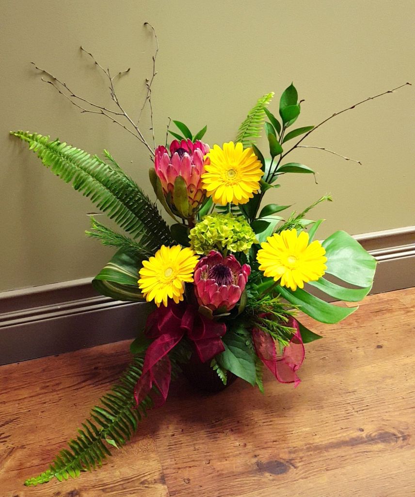VanGoghFlowers's tweet photo. This tropical arrangement with Queen Proteas will make you feel the very heat of summer &amp; sunshine! #VanGoghFlowers #Ptbo #Tropical #Protea https://t.co/7T4aJXeuvc