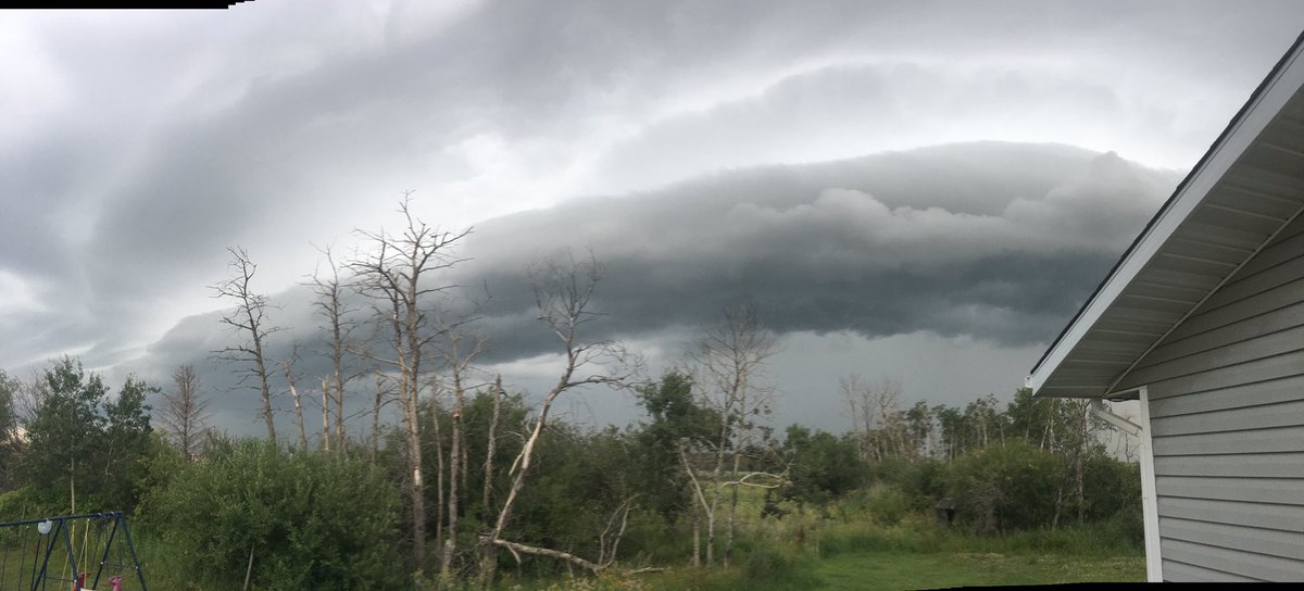 DflyJules's tweet photo. South of Wroxton, 7:40pm. Rain and a bit of wind, but the clouds don't look happy!  #skstorm https://t.co/p42bcDh6Gn