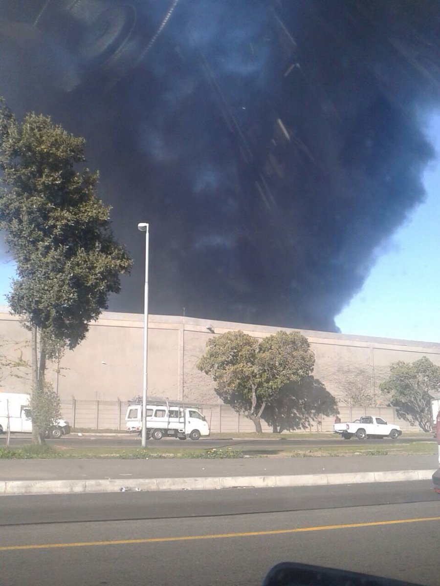 ewnreporter's tweet photo. #Fire Firefighters are on the scene of a fire at a Tafelberg Furnitures warehouse in Epping, Cape Town. IM https://t.co/vGJeIIPE4d