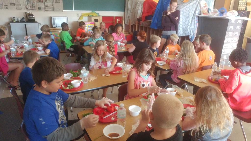 Clinton students making salsa from our garden vegetables.