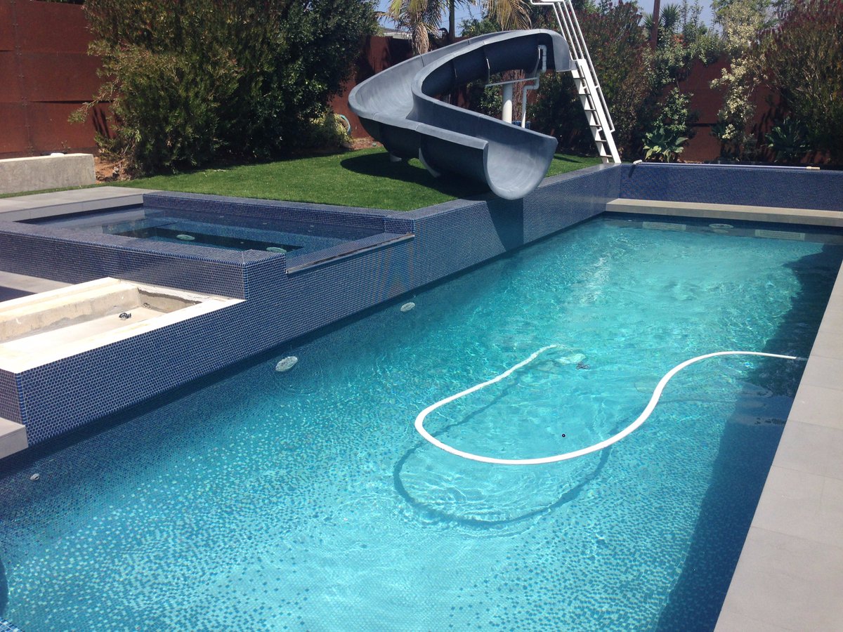 Another completed remodel! This all-tile pool at the Berlin residence is complete with a Riverflow swim jet. Great work by all involved!