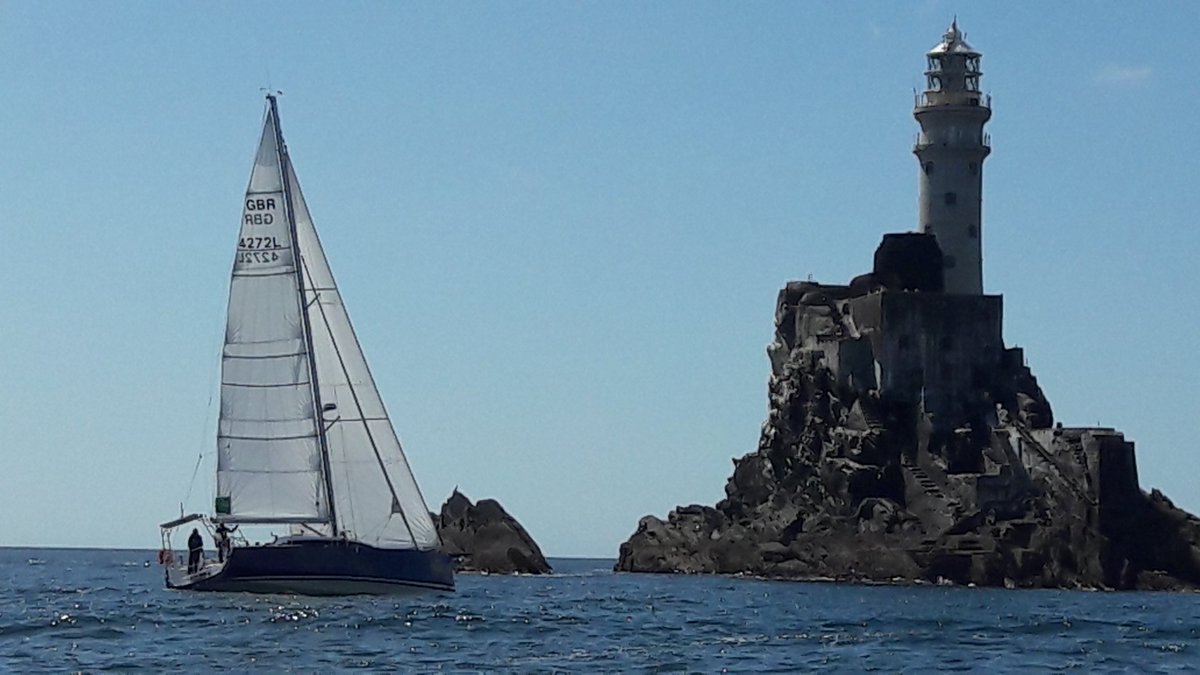 SailMarta's tweet photo. GBR4272L at the Fastnet rock just before us #rolexfastnetrace @RORCRacing https://t.co/mouv5LUR4T