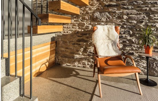 Fancy a neutral palette reading nook set amidst an industrial style staircase? We sure do! po.st/CZrWvg