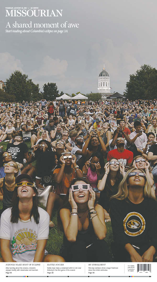 CoMissourian's tweet photo. On today's front page is a shared moment of awe. See more eclipse photos in our e-Edition: https://t.co/yB0WUgKS78 https://t.co/60SyKgxNTX