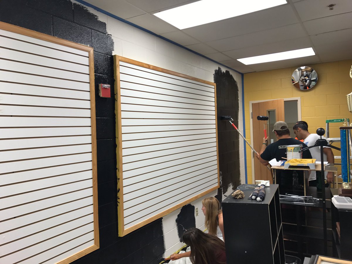 FHSEAGLESDECA's tweet photo. FHS DECA Officers working hard  painting the school store! Brand new spirit wear available! Freshman come Wednesday @Freedom_Perch https://t.co/yVfo3noJMO