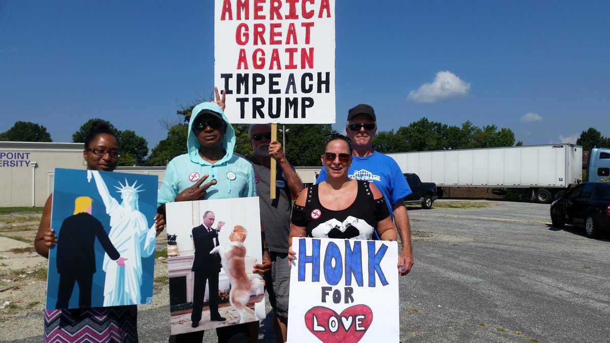 IndivisibleGCo's tweet photo. #TuesdaywithoutTillis with #IndivisibleHighPoint.  Lots of haters today for an anti hate rally.  Super hot out but we persisted. https://t.co/NnXTXaf8Y4