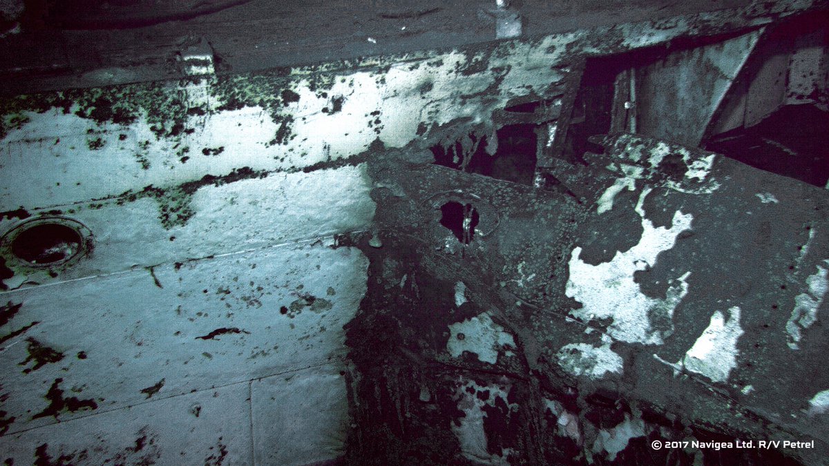 New images of #USSIndianapolis show one of ship's main guns, anti-aircraft gun, gun director &amp; torpedo damage to forward starboard section.