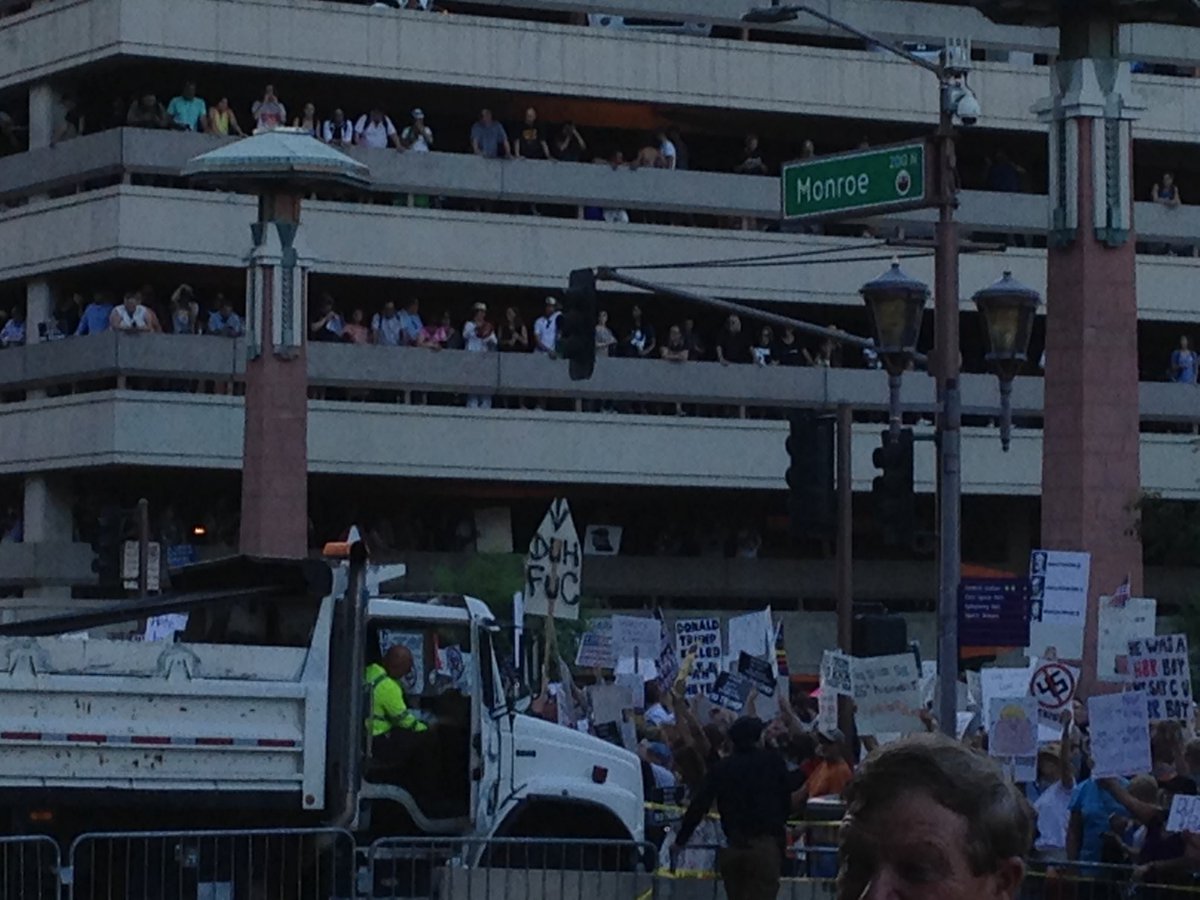 As dusk falls police have moved crowds from side of public parking lot overlooking ground zero