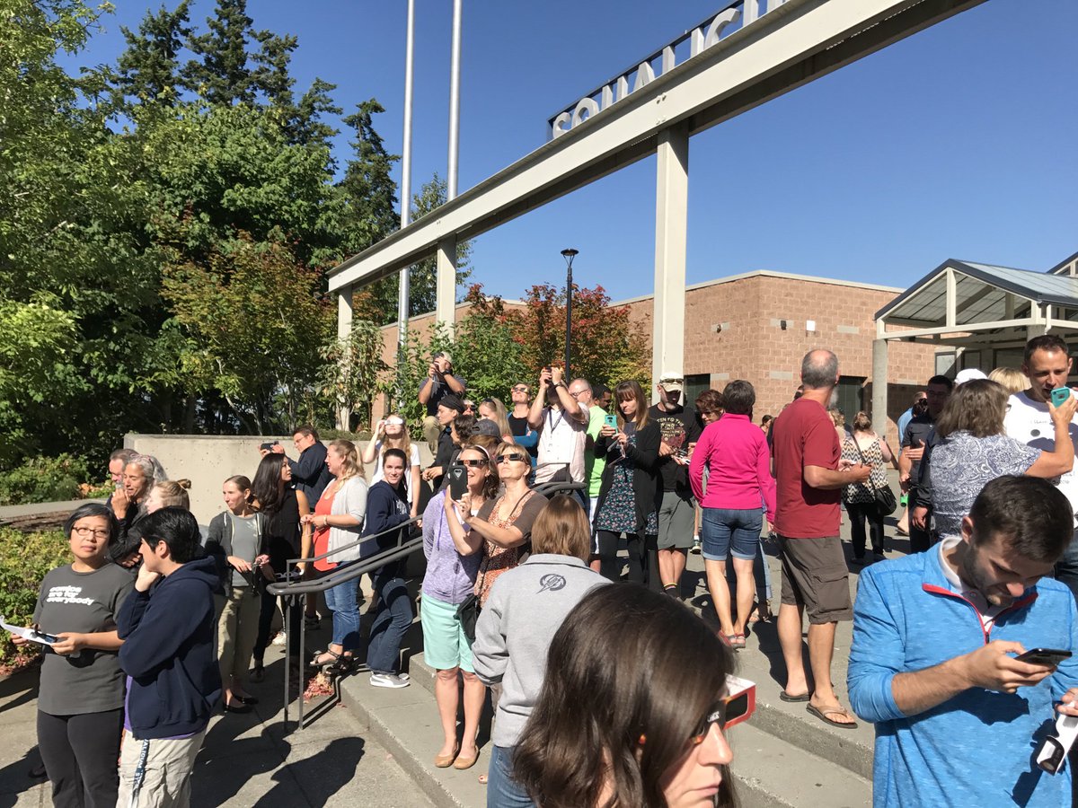 ProfeHite's tweet photo. Teachers checking the #Eclipse2017 yesterday @ #SqHS. Jeez that was cool! https://t.co/Gv05P5TFQU