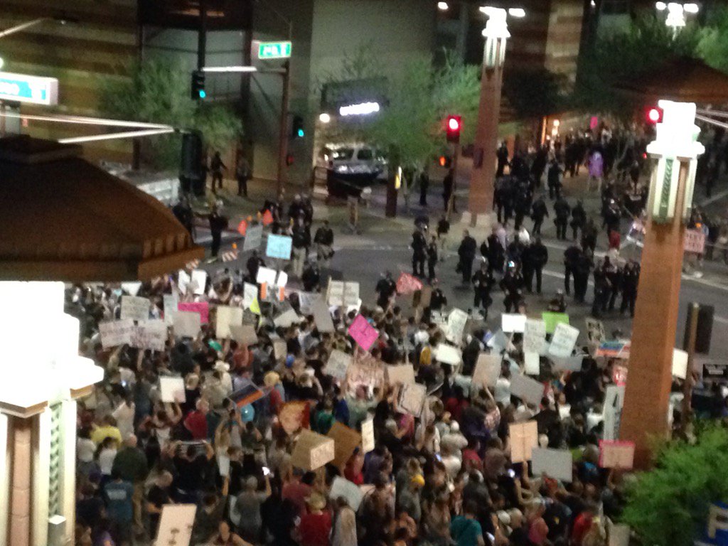 Crowd louder now, police moving crowds back from intersection