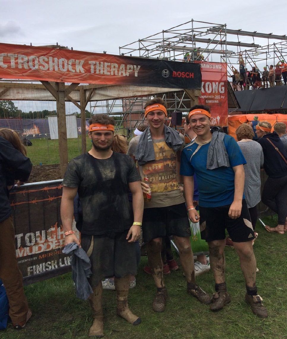 Check out our runner <a href="/kylerimmer36/">Kyle Rimmer</a> at the finish line of <a href="/ToughMudder/">Tough Mudder</a> last weekend (in the middle). Inspired by team #MissionMudder. Go Kyle