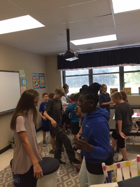 TweetDCS_OGCES's tweet photo. Mrs. Gilbert's homeroom learning a classroom handshake to help create unity. #onlyoneyou #TeamOGCE #TeamDCS https://t.co/qs4H9XiUMb