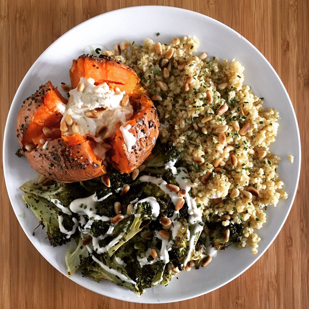 #vegan 💚 #roasted #sweetpotato and #broccoli with #cashewcream and #bulgarwheat topped with roasted #pinenuts #veganfood