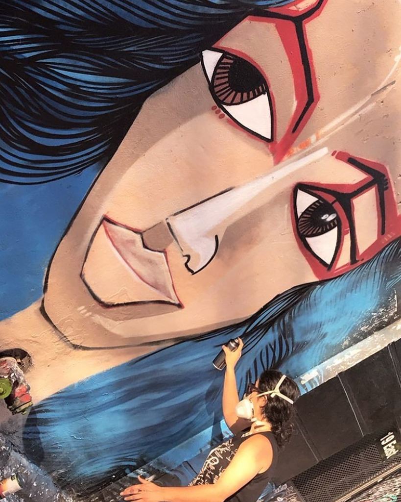 Retouching my mural on 3rd street commissioned by @lamamaetc and @fourthartsblock 📷 by @reggierevels