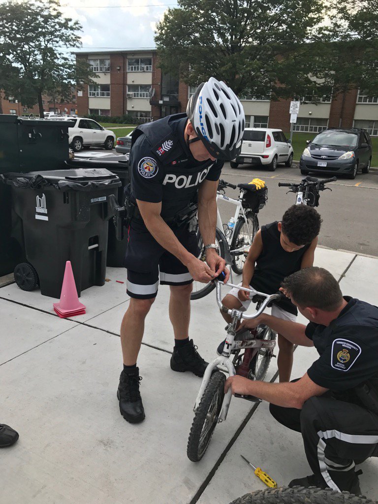 TPSCoop's tweet photo. S/Sgt Andy Sawyer, installs bell #positive engagement Lawrence Hts Comm @TorontoPolice @TOHousing @JoshColle @NH32B https://t.co/6kQfiD3OaC