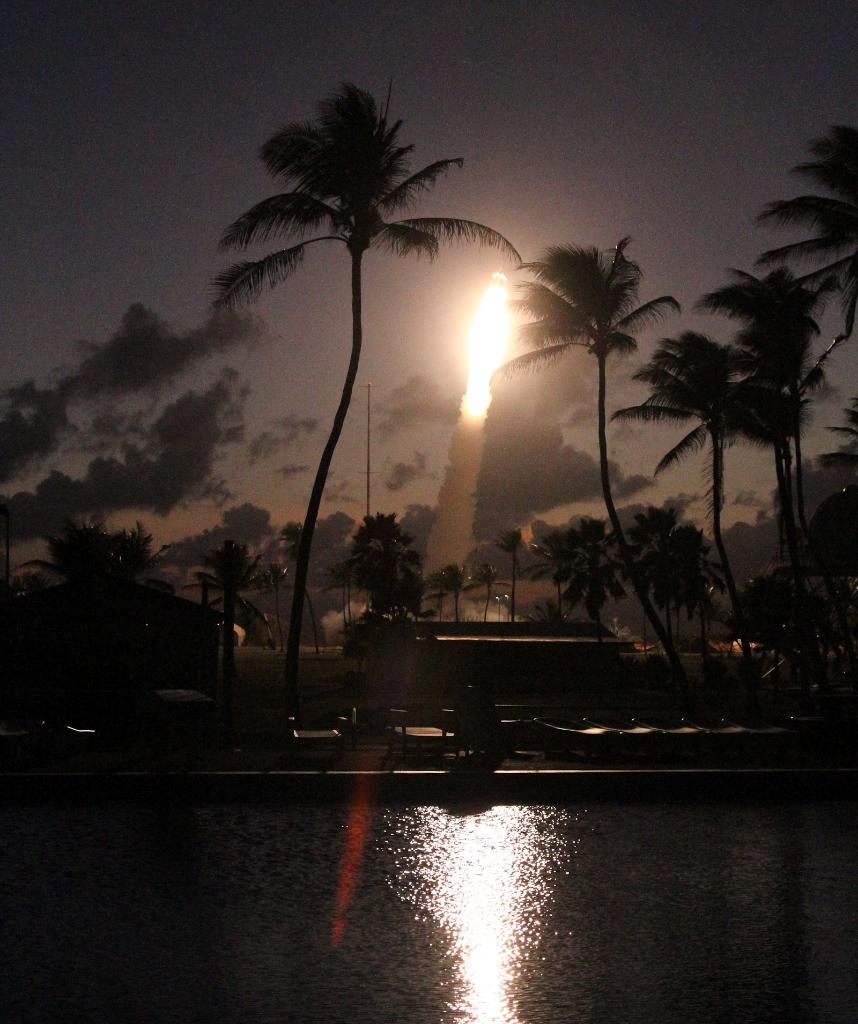NASA's tweet photo. White artificial clouds and 2 research rockets over the Marshall Islands will help us study atmospheric disturbances https://t.co/VBWnSMVZ30 https://t.co/SgsWv90VH9
