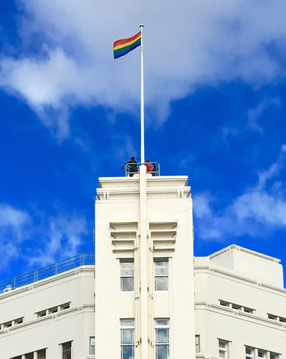 RonChristie's tweet photo. Lord Mayor Sue with Rodney Croome &amp; Susan Ditter raise the Rainbow Flag on Council building as onlookers at St Davids Park applaud &amp; cheer https://t.co/ARPM5wM3LM