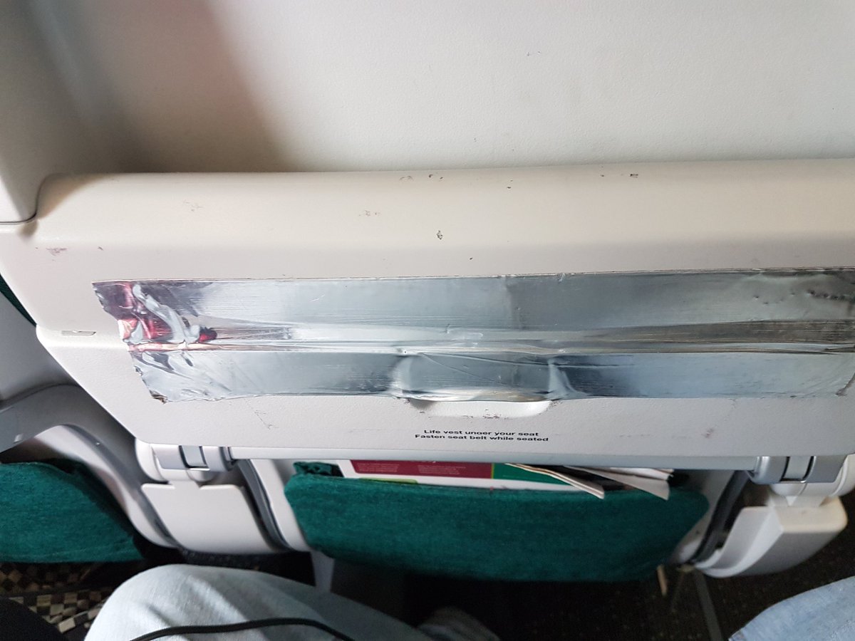 PaulHicks80's tweet photo. Nice 'choice' seat with @AerLingus. 9 hours with no tray and a beat up seat and my childs seat the audio system doesn't work and epic fail!! https://t.co/eGjjvdGXwC