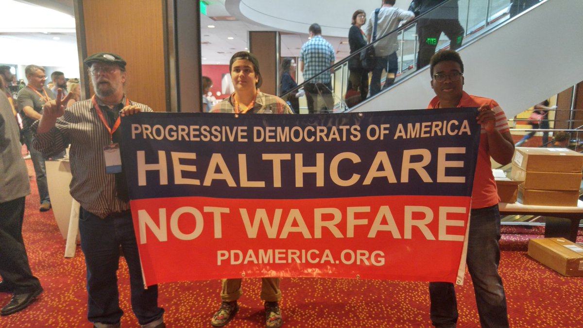 amosmiers's tweet photo. Healthcare NOT Warfare! https://t.co/mPuT2F5tSS #Netroots2017 @pdamerica @PdaFox https://t.co/9HjO7ngK90